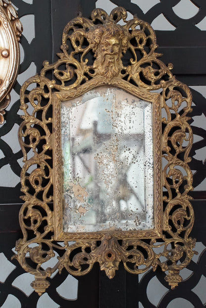 Antique Brass Bacchus Beveled Mirror by Bradley and Hubbard