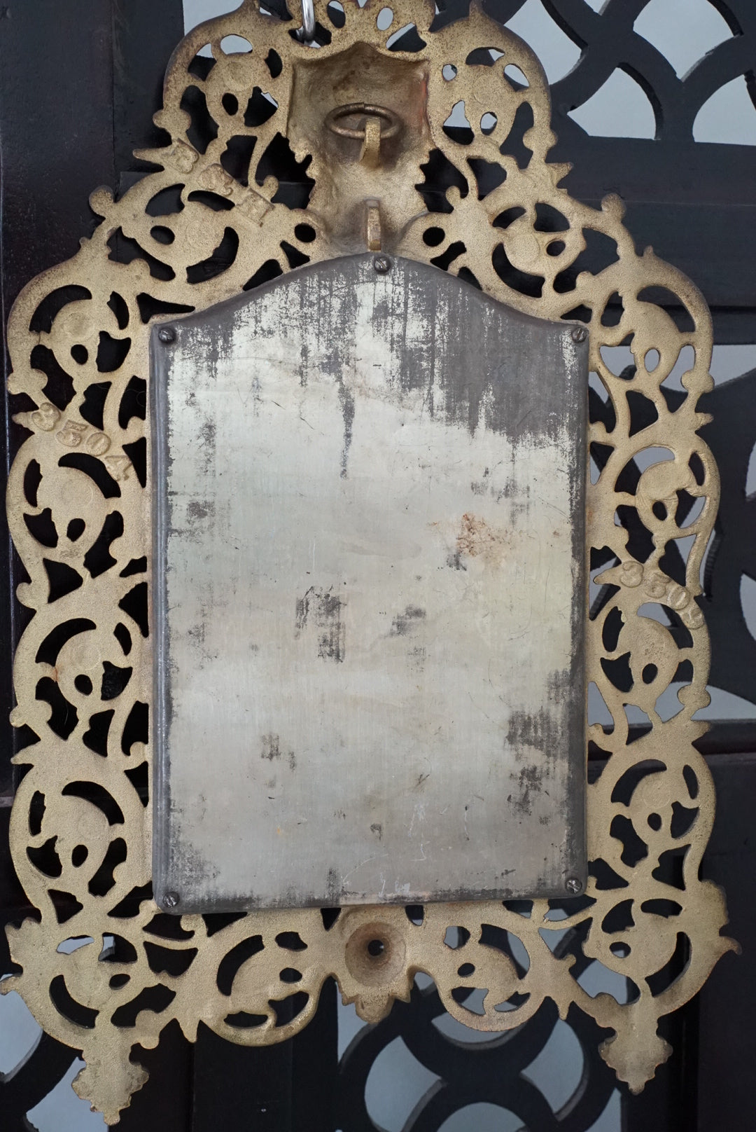 Antique Brass Bacchus Beveled Mirror by Bradley and Hubbard