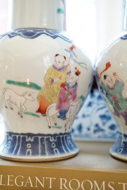 Pair of—Famille Rose Vases with Children at Play Motif